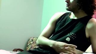 Handsome dude with curly black hair jerking off his big cock