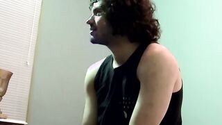 Handsome dude with curly black hair jerking off his big cock