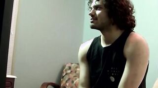 Handsome dude with curly black hair jerking off his big cock