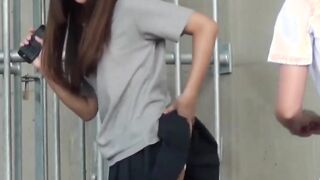 Two girls get caught pissing and filming each other outside