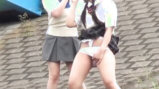 Outside pissing competition with two young Japanese pupils