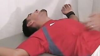 Ticklish and sexy soccer player is bound on the table