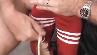 Ticklish and sexy soccer player is bound on the table