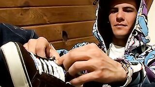 Young foot lover Clyde strokes his cock and cums on his feet