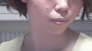 Japanese cutie taped undressing and playing with her pussy