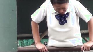 Naughty Japanese schoolgirls pissing in secret public place