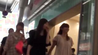 Real Japanese hotties taped up skirt while shopping