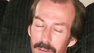 Guy with a mustache tugs his cock before cumming hard