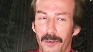 Guy with a mustache tugs his cock before cumming hard