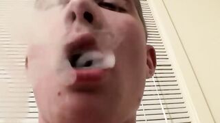 Twinks Cain and Ty Frost blowing while smoking cigarettes