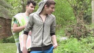 Young guys have an outdoor massage and blow each other