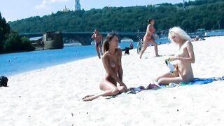 Ravishing nude beach girls tanning