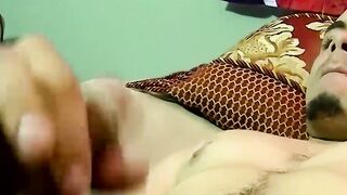 Amateur guy jerking off his juicy cock on the bedroom bed