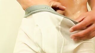 Pretty twink takes a shower with his undies and jerks off