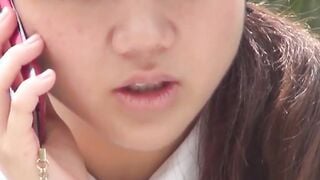 Cute Japanese schoolgirl taped up skirt outdoors