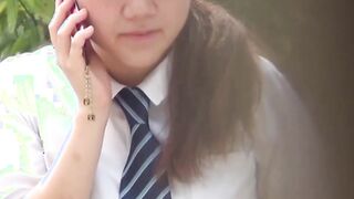 Cute Japanese schoolgirl taped up skirt outdoors