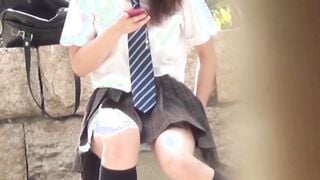 Cute Japanese schoolgirl taped up skirt outdoors