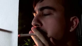 Cute young smoker works on his stiff dick and spunks