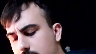 Cute young smoker works on his stiff dick and spunks