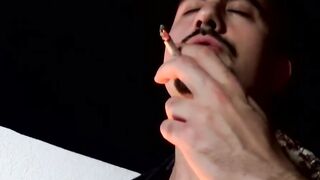 Cute young smoker works on his stiff dick and spunks