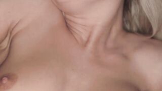 Naughty blonde in black lingerie rubs her pink soft pussy