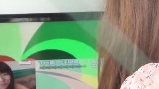 Japanese chick plays with her pussy while watching hot porn