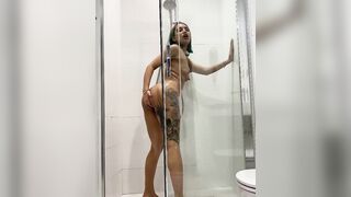 Inked women riding a dildo inside the shower