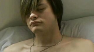Gorgeous blonde twink having fun with himself on a bed