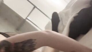 Blonde hairdresser blows on a long meat pole