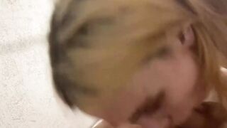 Blonde hairdresser blows on a long meat pole