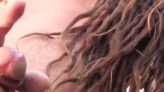 Dreadlocks stud plays with his nuts and dick outdoors