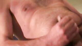 Experienced mature guy strokes his dick and cums solo