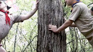 Scouts Marcus and Troye kneels for Scout Leaders dicks