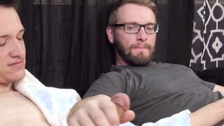Two buddies with saggy balls masturbate together and cum
