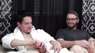 Two buddies with saggy balls masturbate together and cum