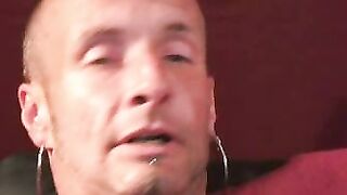 Tattooed mature gay jerks off big dick and unloads hot cum
