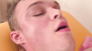 Blond stud has limp dick rubbed by two twink masseurs