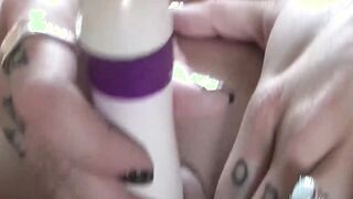 Blonde inked MILF Lisa Low massaging her pussy with dildo