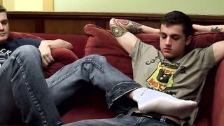Inked stud Chris Porter receives footjob from Bryce Corbin