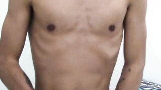 Tattooed dark skinned amateur sticks dildo on wall to play