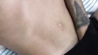 Tattooed dark skinned amateur sticks dildo on wall to play