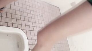 Beautiful Japanese women taking a piss in the bathroom