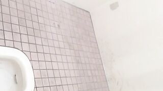 Beautiful Japanese women taking a piss in the bathroom