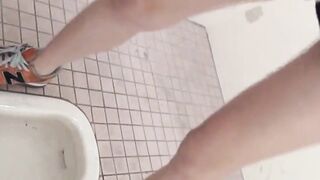 Beautiful Japanese women taking a piss in the bathroom