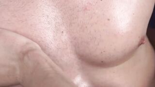 Athletic twink oiled up and cock stroked by hunky gay
