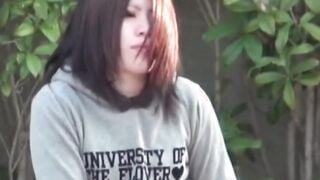 Young Japanese babe filmed toying pussy at a bus stop