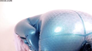 Beauty Arya Grander wearing shiny rubber clothing and seduce by pvc bdsm catsuit for satisfaction