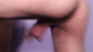 Tanned slim twink loves stroking his shaved balls on camera
