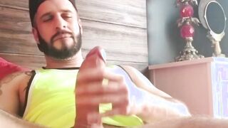 Bearded muscle hunk wanking his big dick and moaning hard