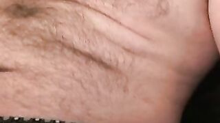Fat hairy guy plays with his hard dick and unloads jizz